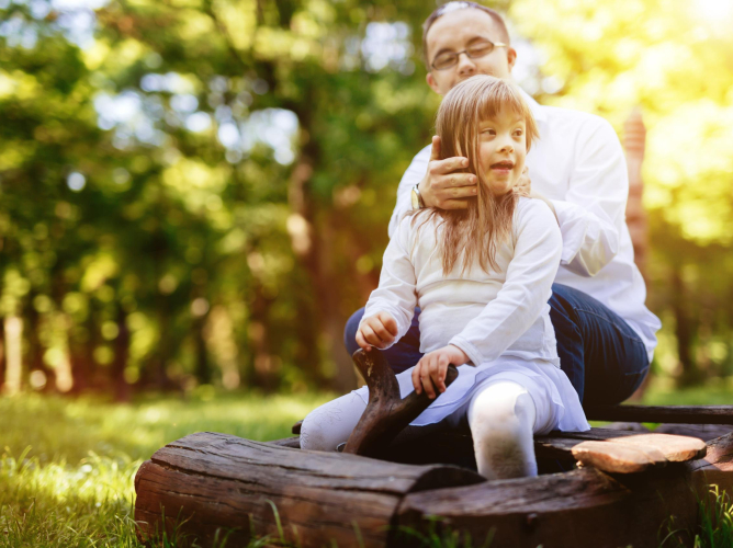 People with down syndrom caring for each other and happy together